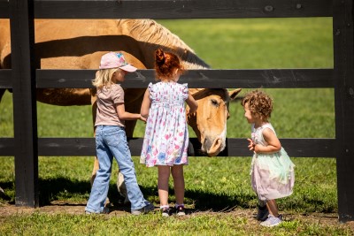 Children embracing nature on the forever-protected Stevens Family Farm Wadmalaw Island SC